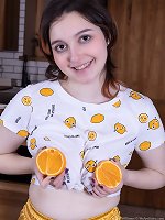Krista Williams enjoys an orange and nakedness